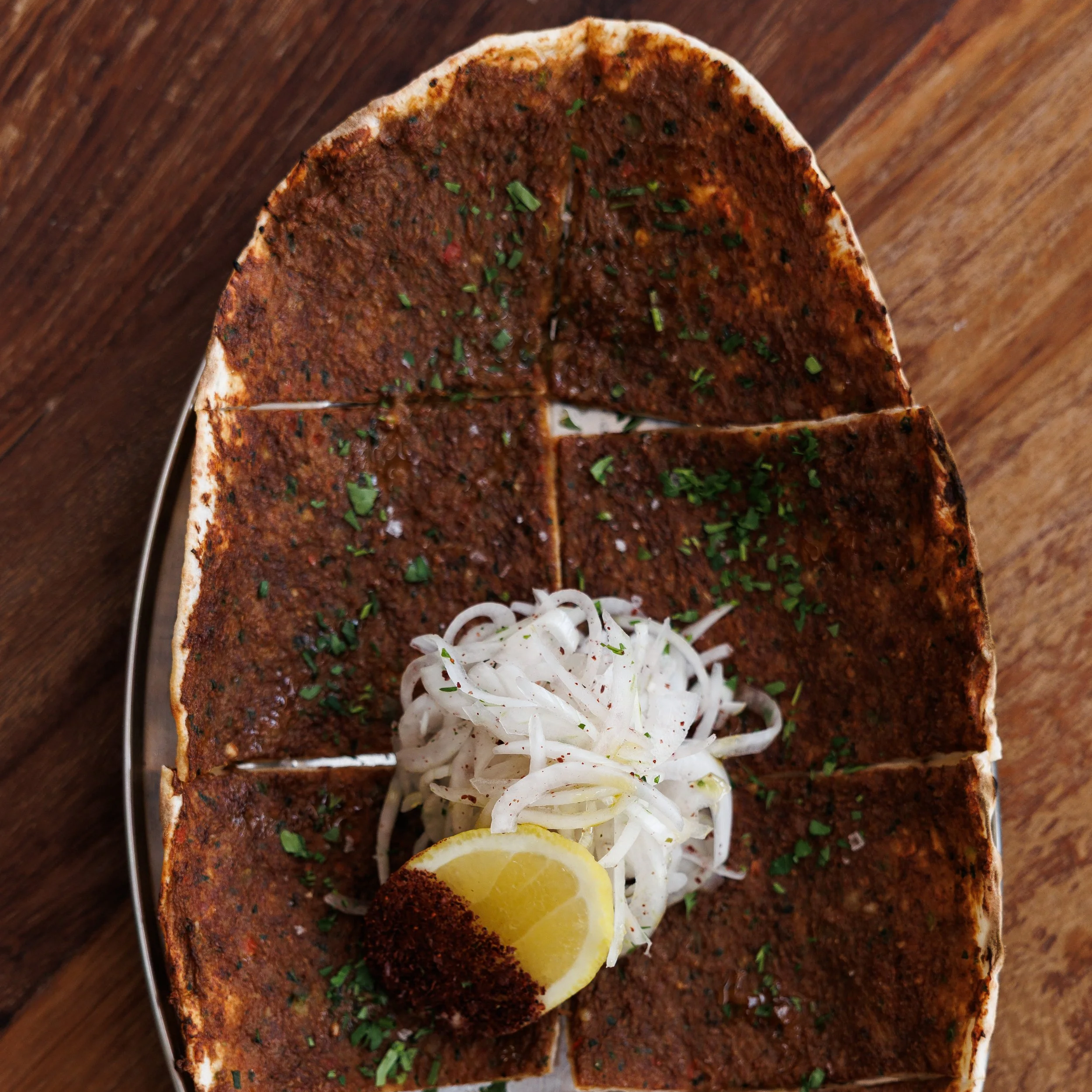 Nan-e Goost / spiced lamb, tomato & herb flatbread / 42 AED