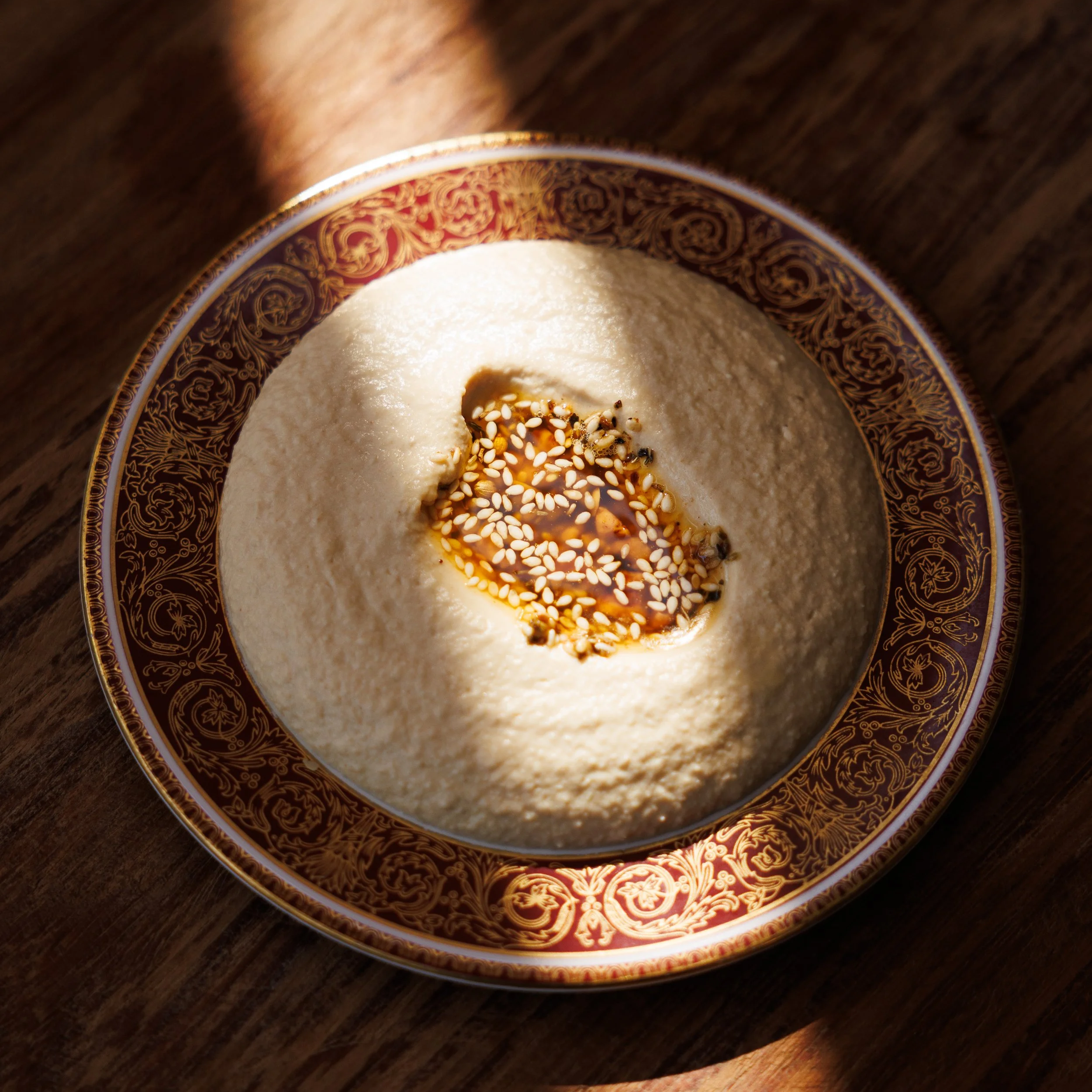 Hummus / tahini, lemon, pine nut, warm brown butter / 36 AED
