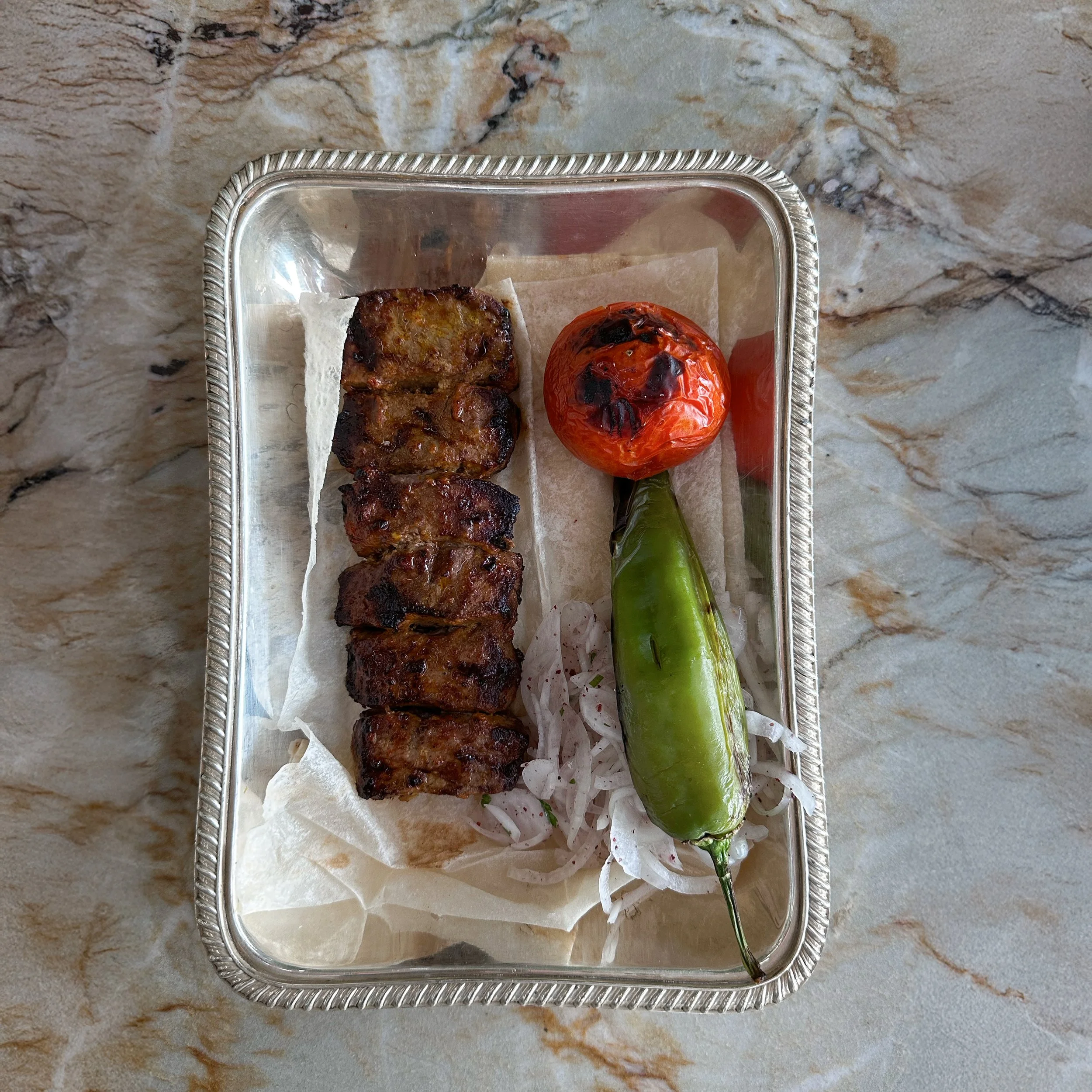 Beef Chenjeh / red shatta & lemon marinated beef striploin / 136 AED