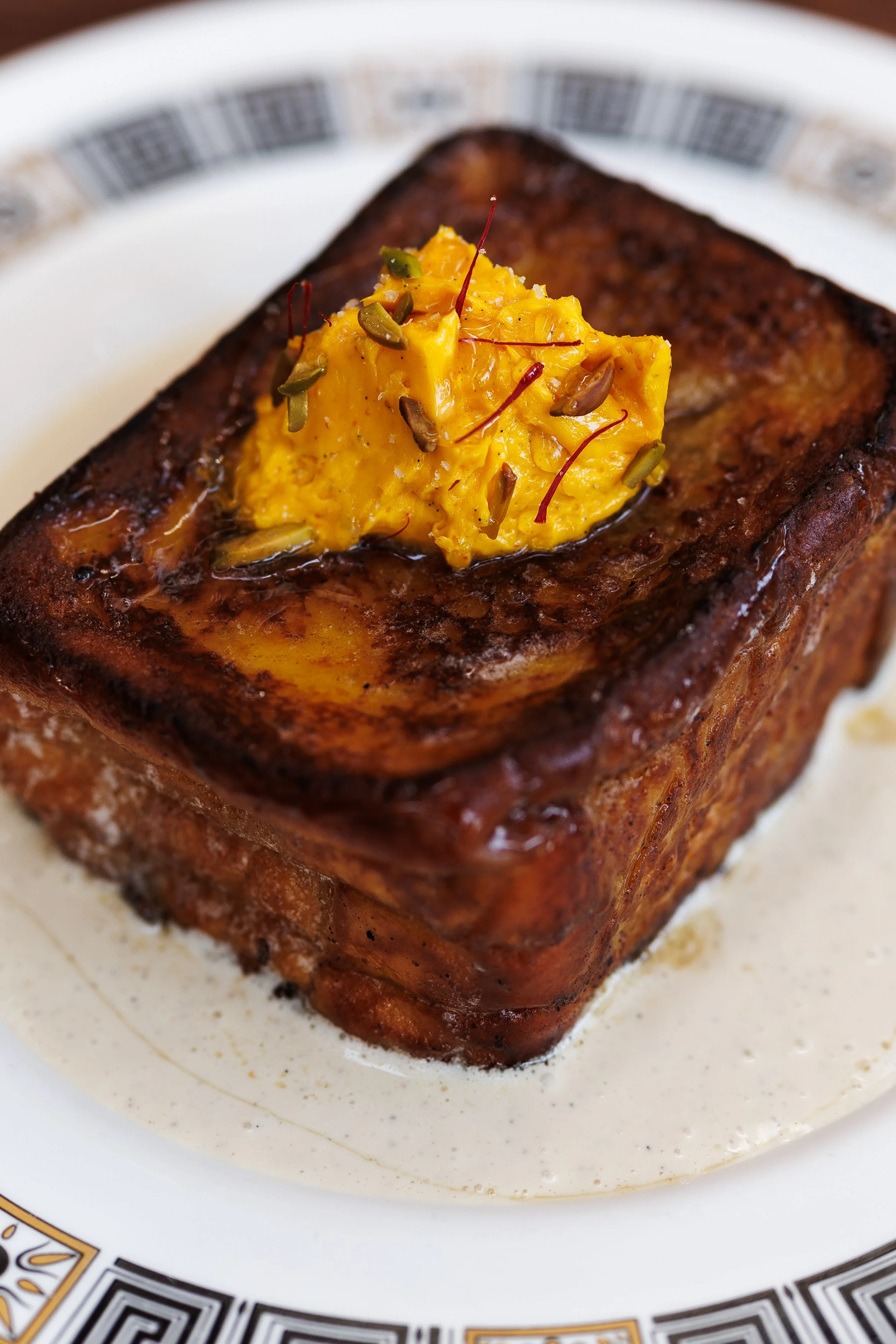 Bastani Sonnati French Toast / saffron & rose butter, pistachio, vanilla custard, cardamom honey / 58 AED