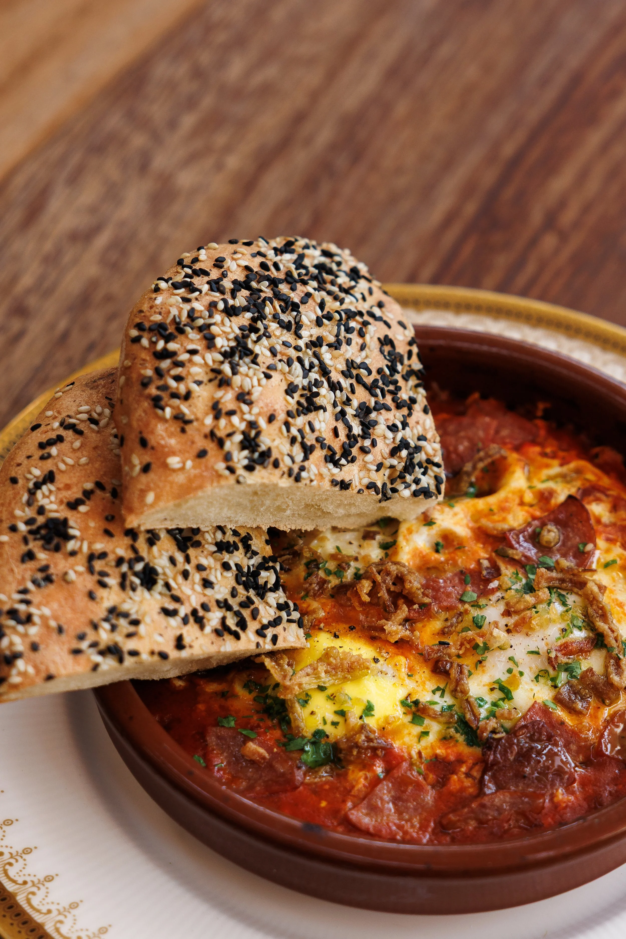 Sausage Shakshuka / Spiced beef sausage, tomato khoresh, spinach, eggs / 63 AED