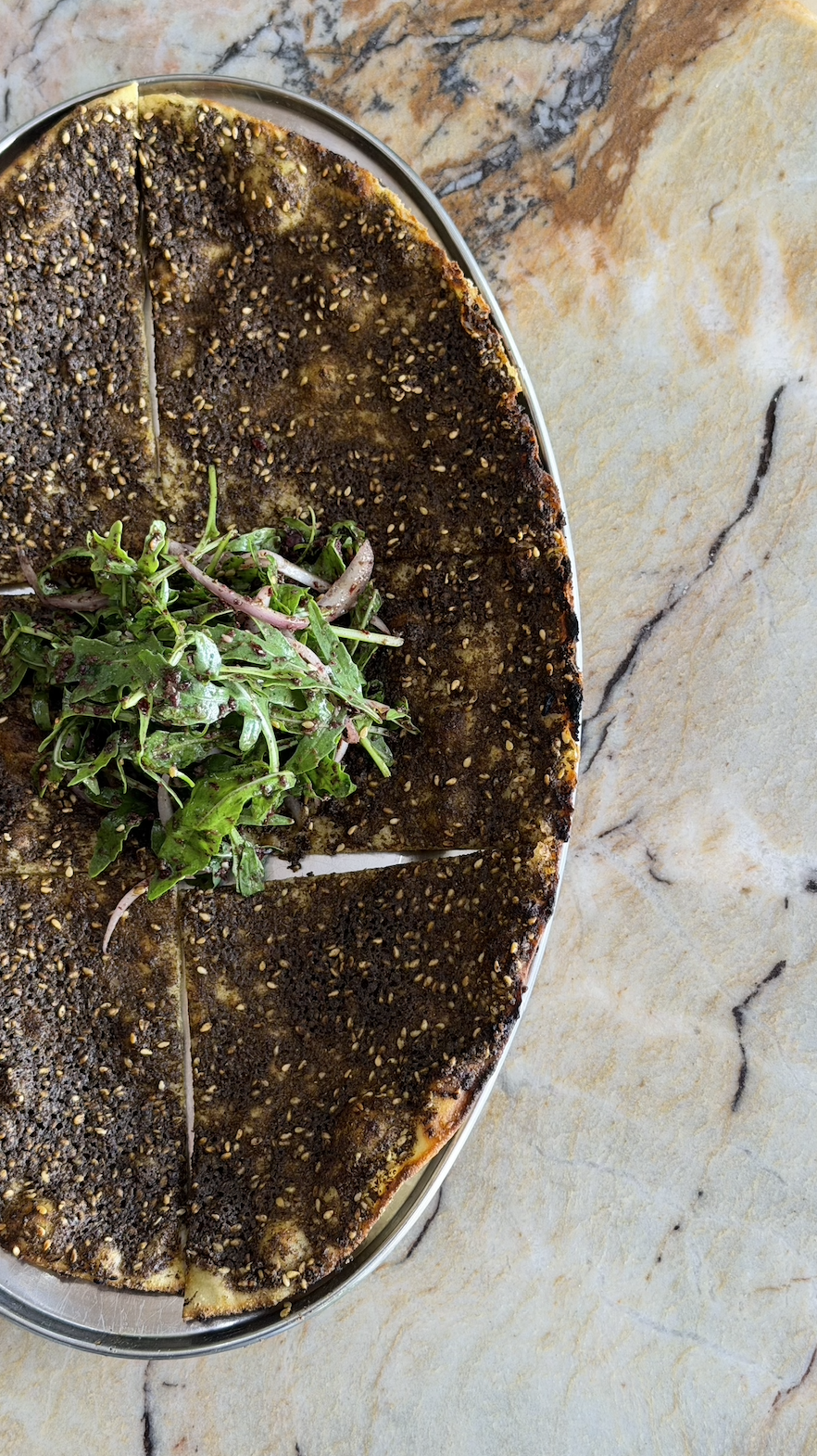 Nan-e zaatar  / wild herb & sesame sourdough flatbread / 39 AED
