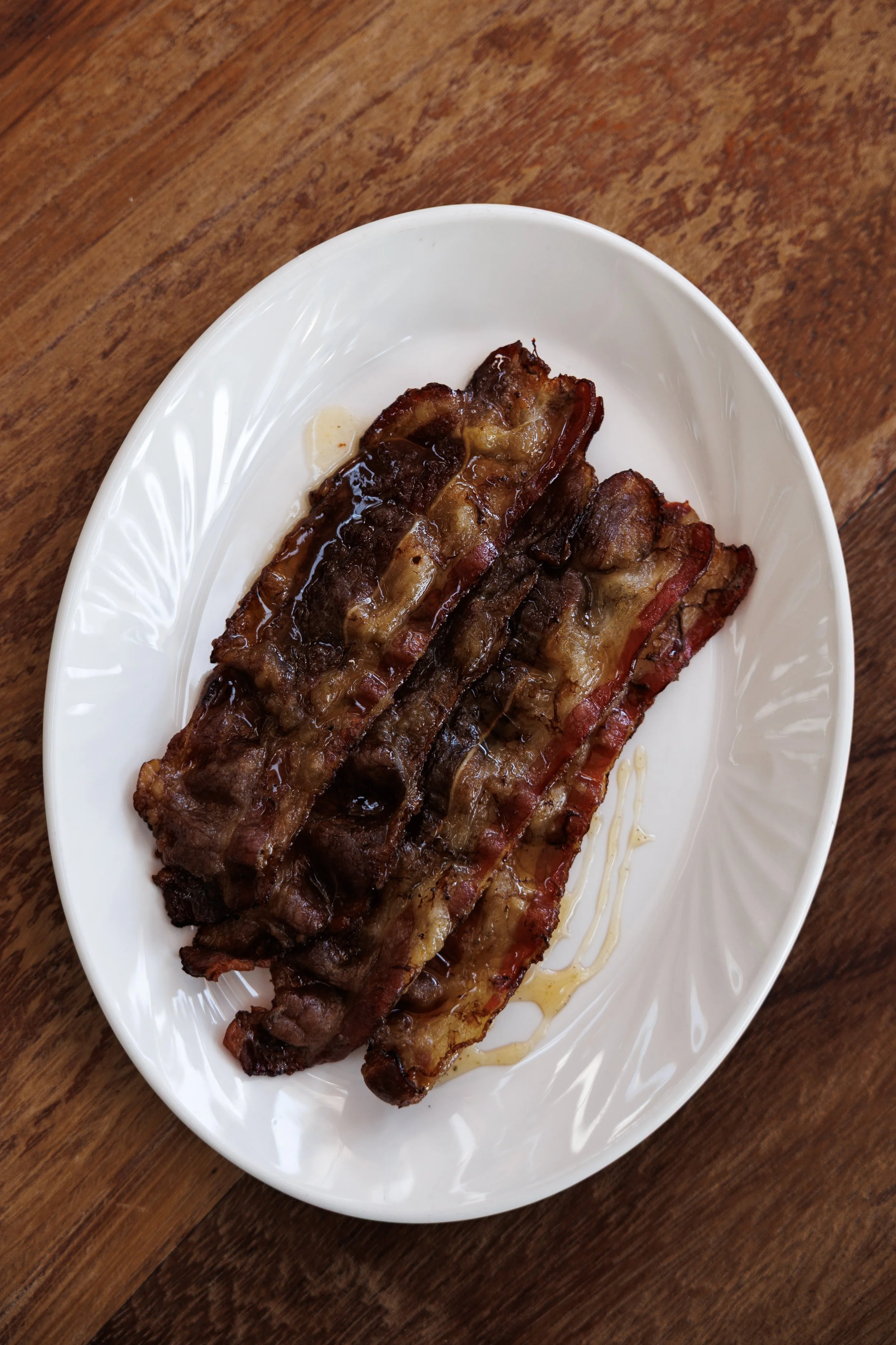 Beef bacon / cardamom honey / 24 AED