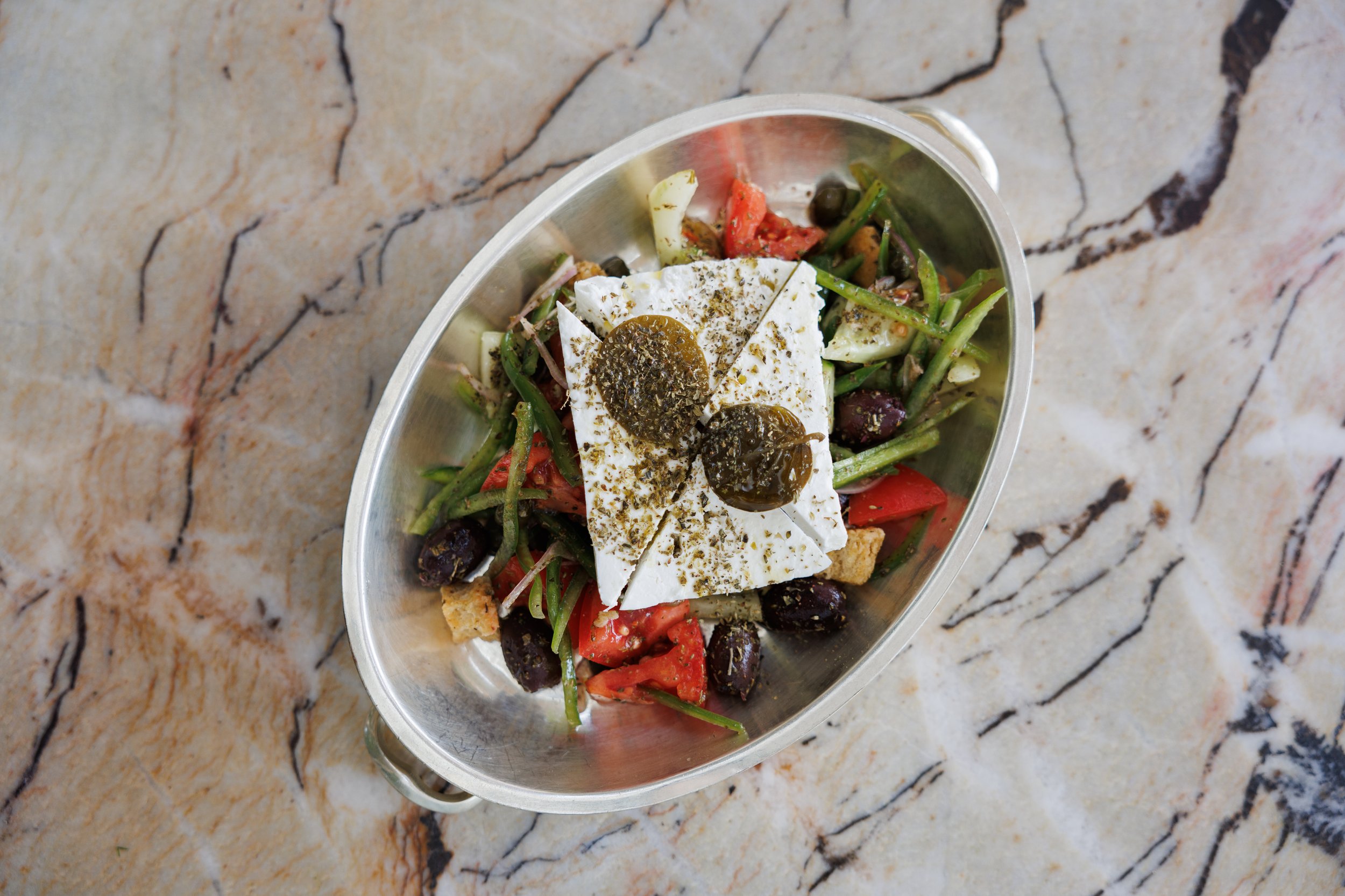 Greek Salad / feta, cucumber, tomato, red onion, green pepper & fresh herbs / 62 AED