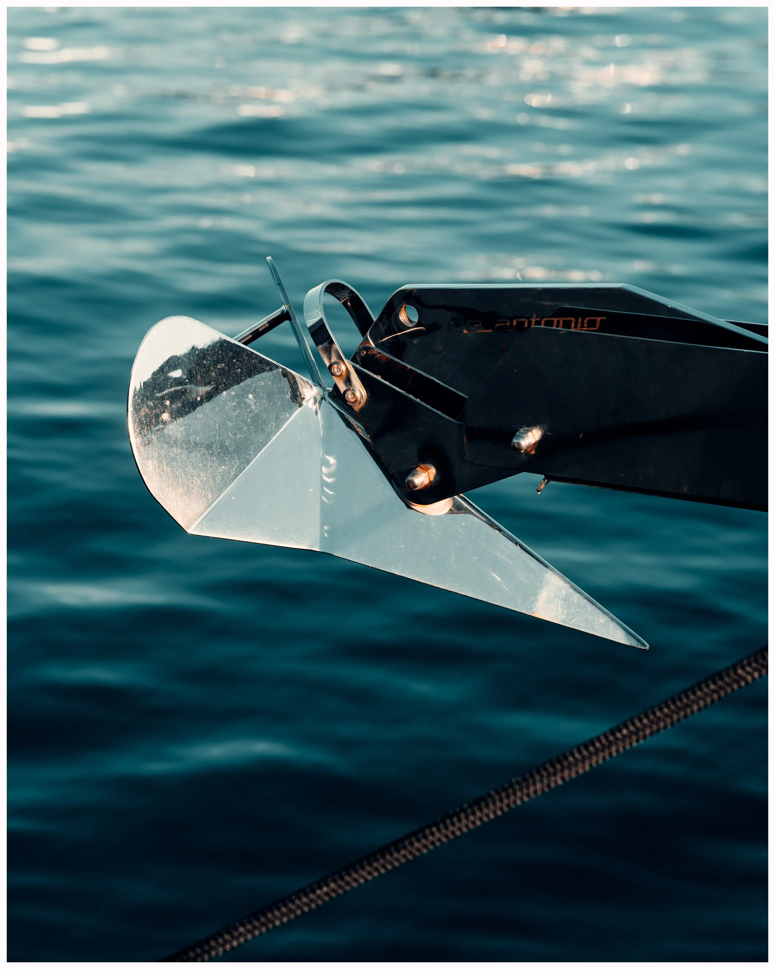 Boat anchor and bow roller over water