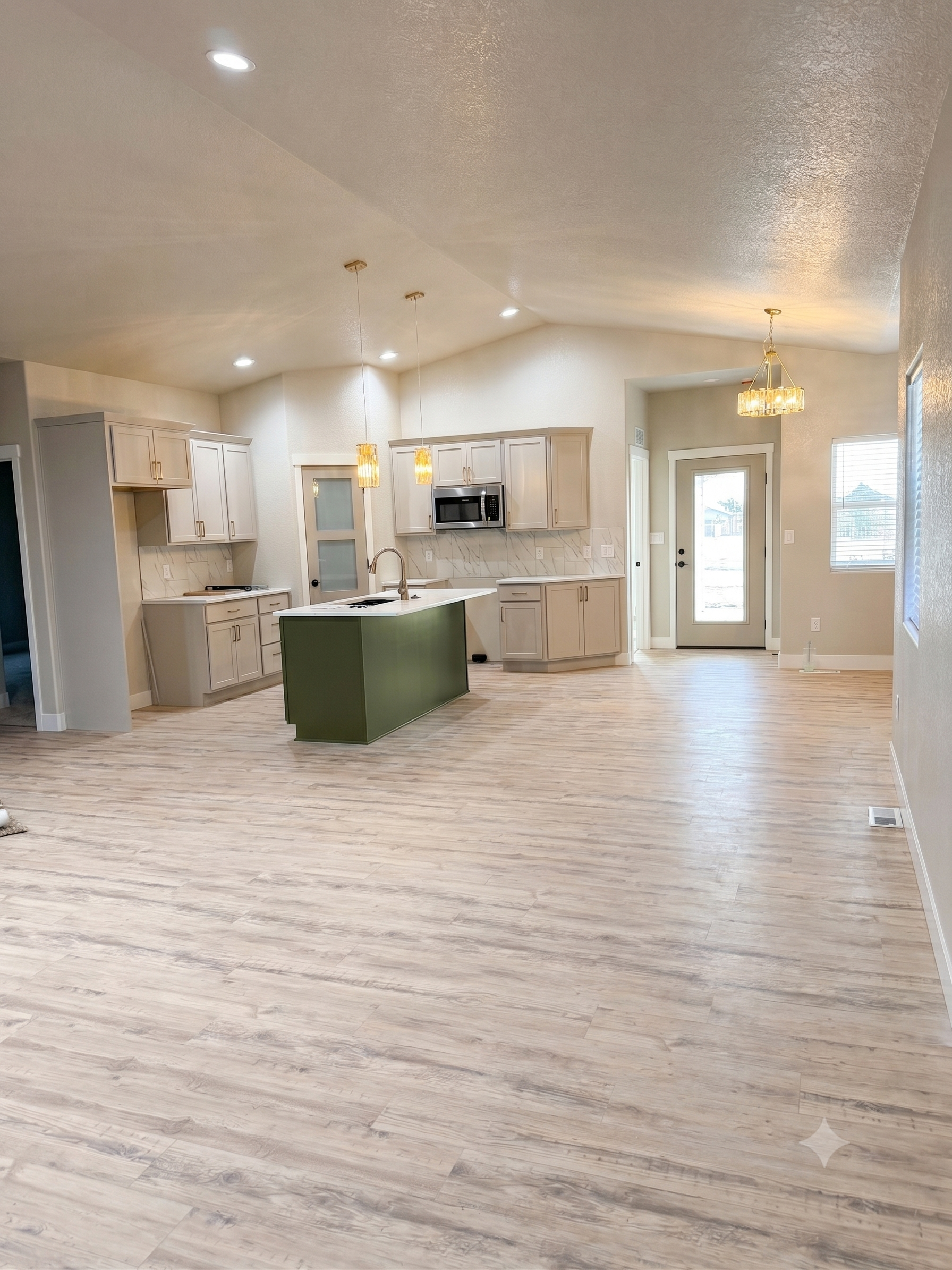 Open concept kitchen and dining with two tone cabibets, gold hardware and kitchen island