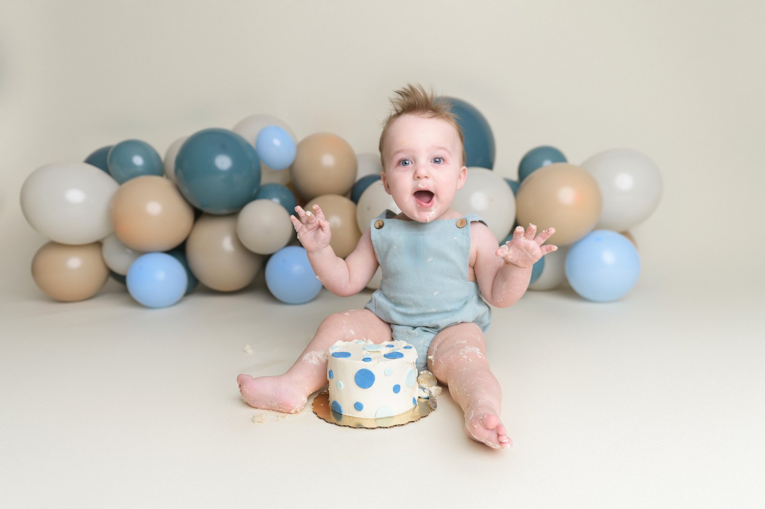excited baby during cake smash