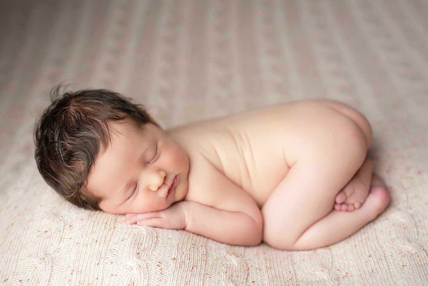 curled up newborn