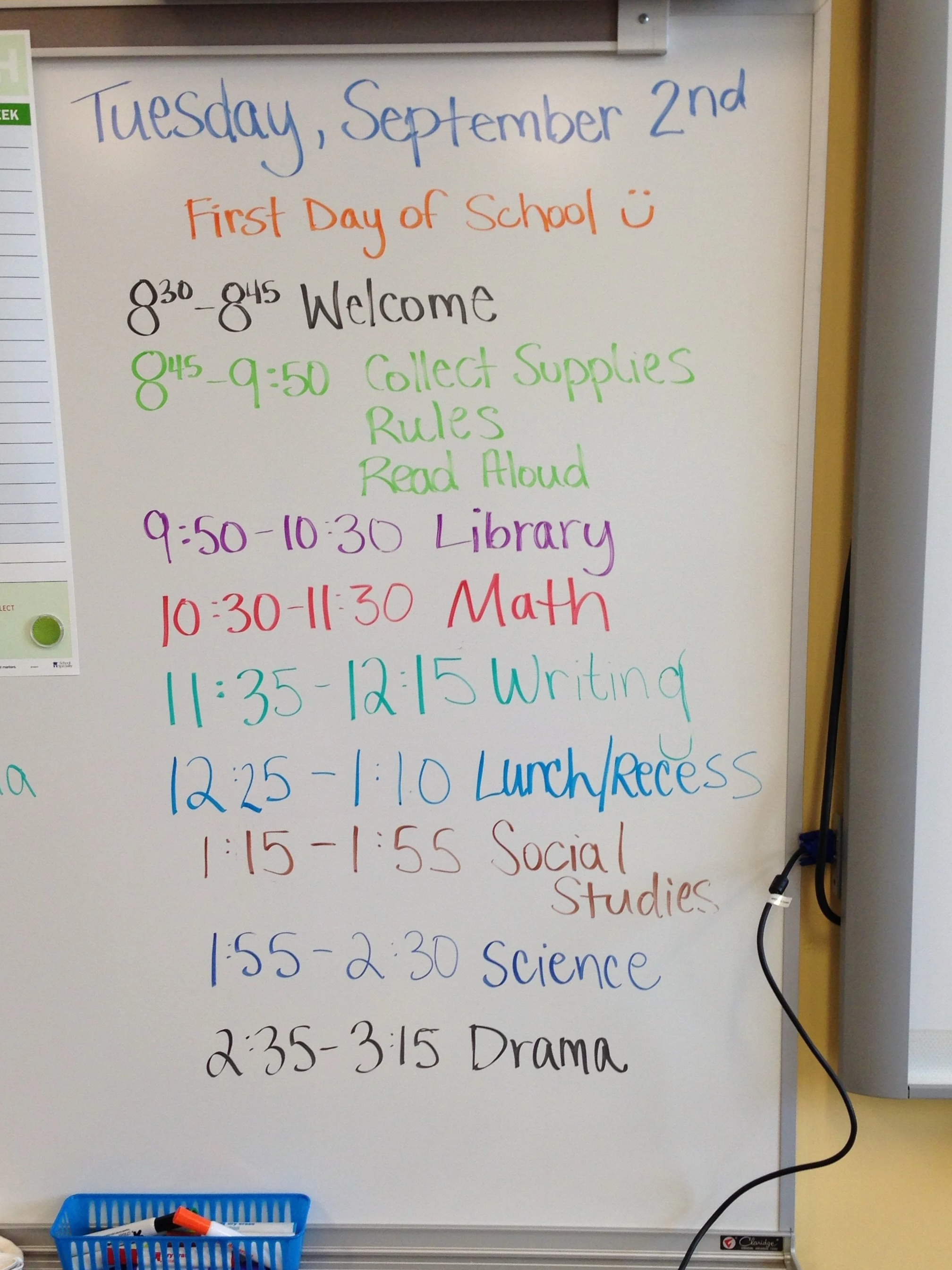 colorful handwriting on a white board listing school schedule subjects and times