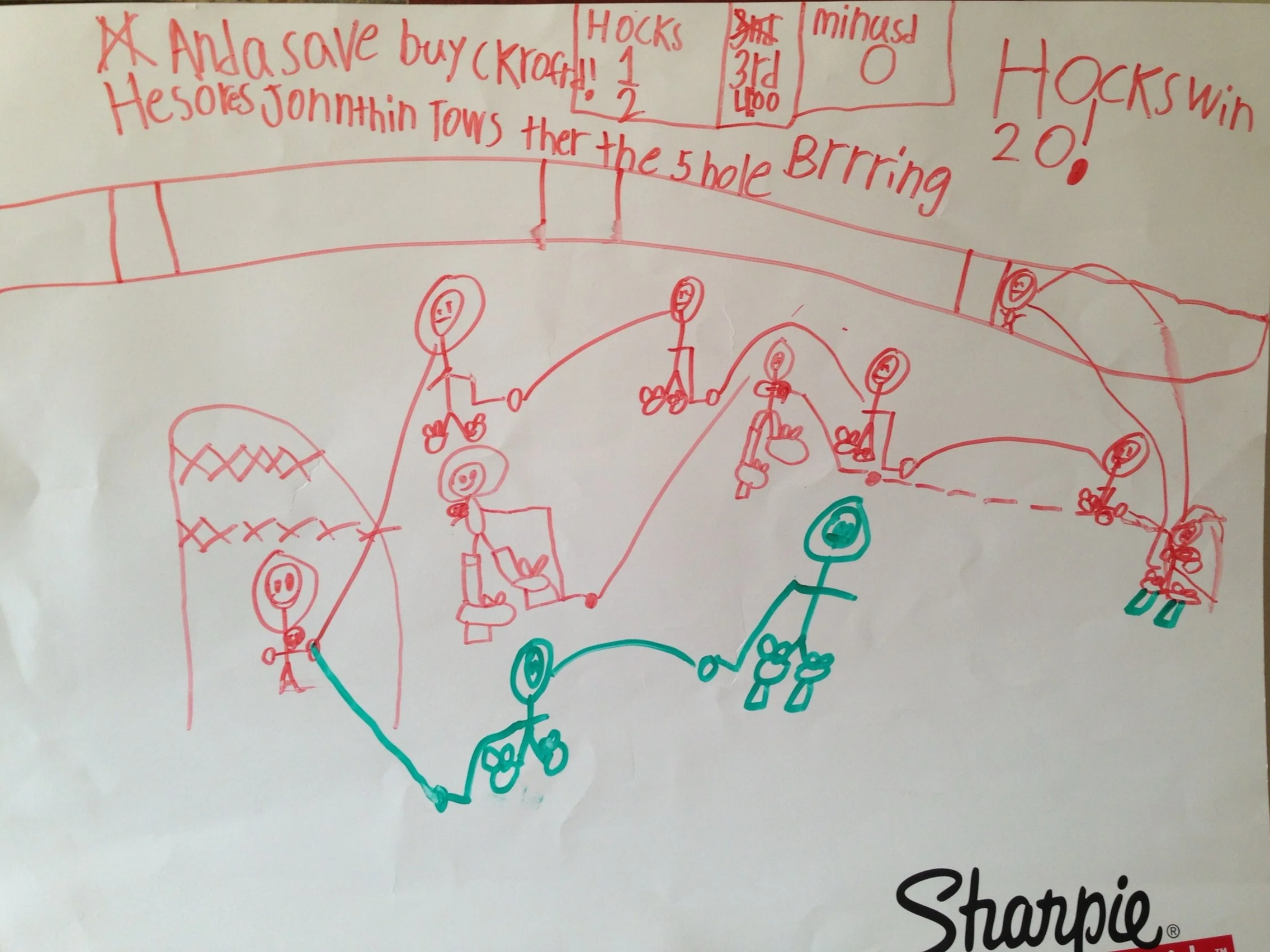 white page with kids line drawing in red and green showing scene from hockey game with hocks win