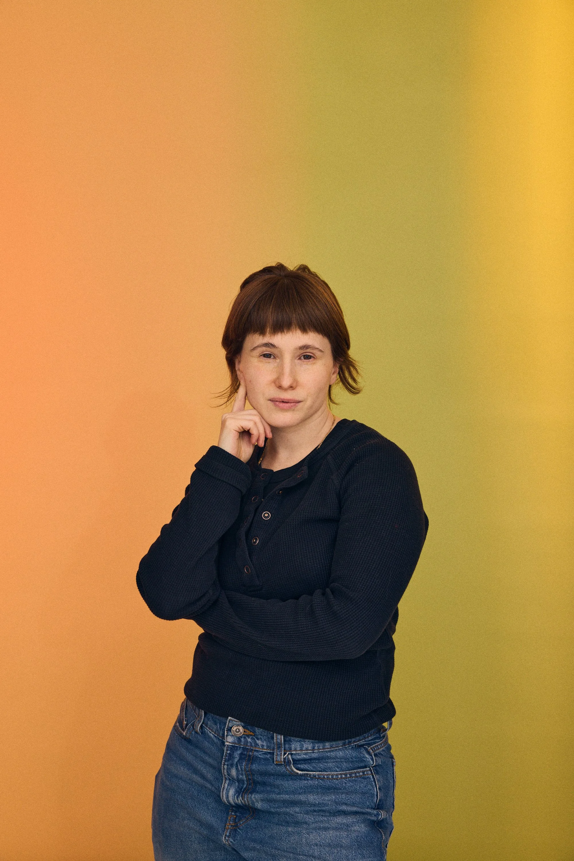 Photographer Stephanie Price in her Brooklyn New York Studio on a green backdrop