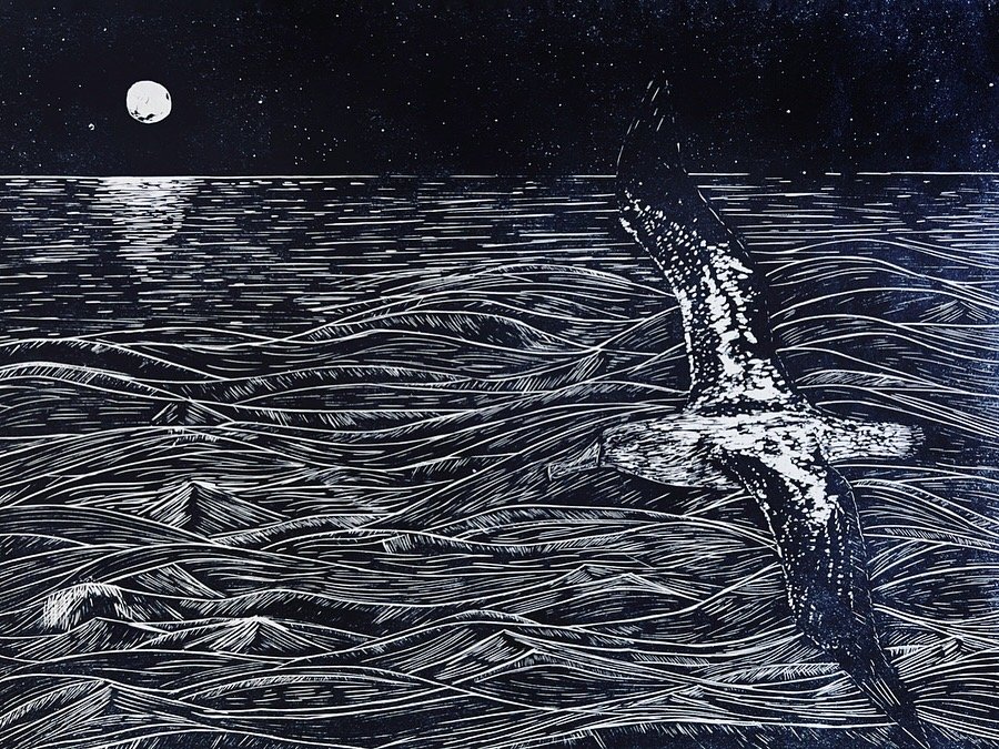 Wandering Albatross flying over the ocean and moonlight