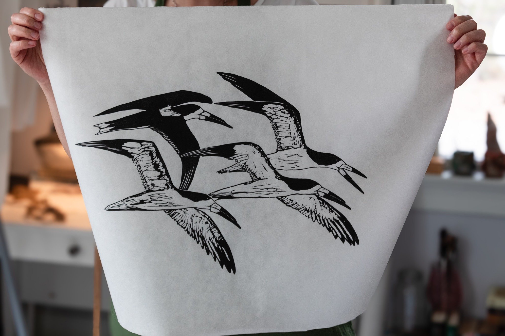 linocut print of black skimmers