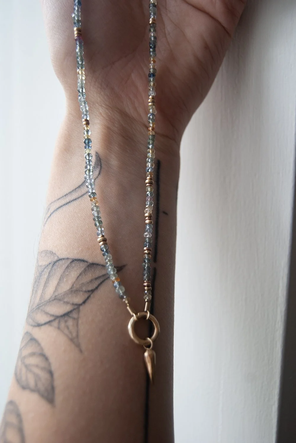 Sapphire necklace on arm.jpg