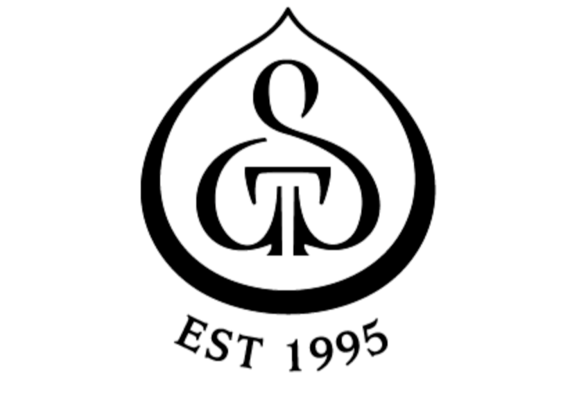 A black and white logo featuring a stylized leaf with an intricate design inside, with the text "EST 1995" below.