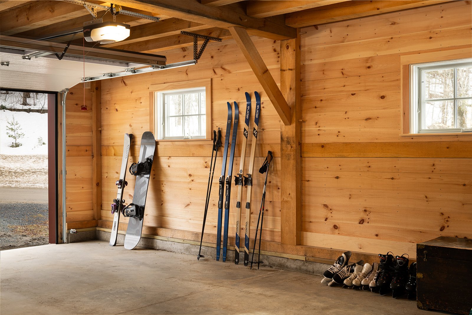 The garage provides plenty of space for outdoor equipment storage.