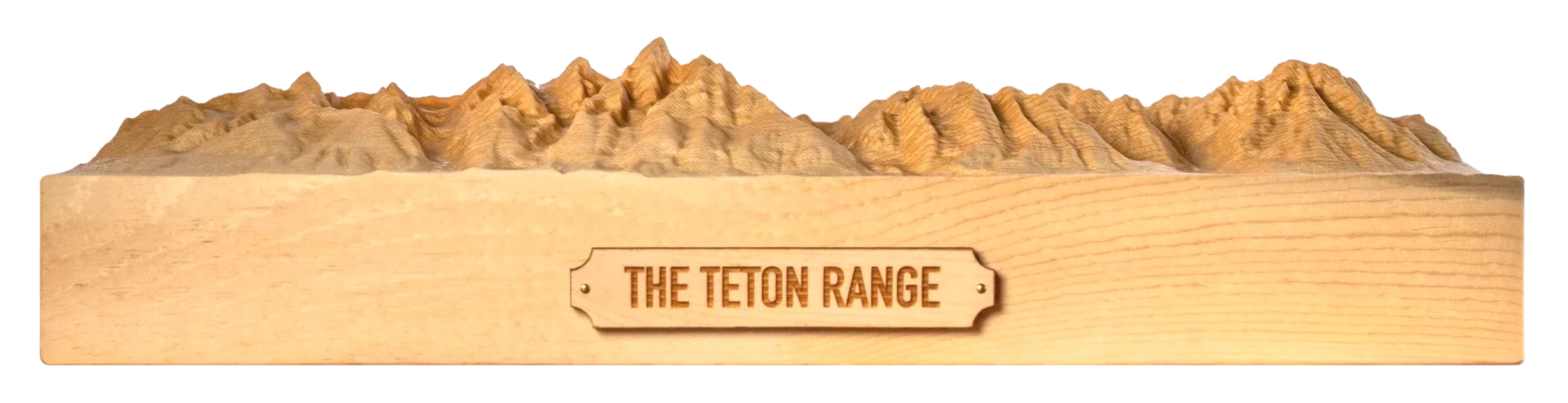 Wide wood terrain carving of the Teton Range with an engraved Teton Range plaque