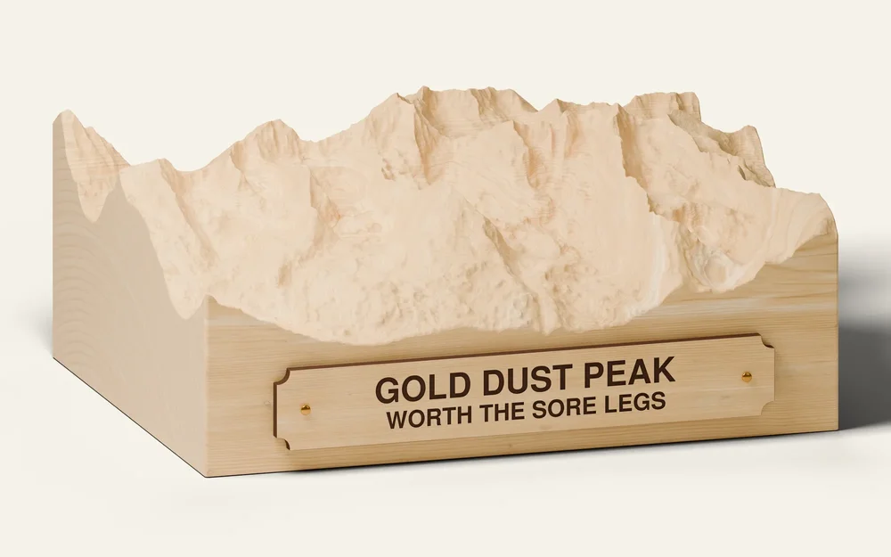 Gold Dust Peak custom wood terrain carving with an engraved plaque reading Worth the Sore Legs