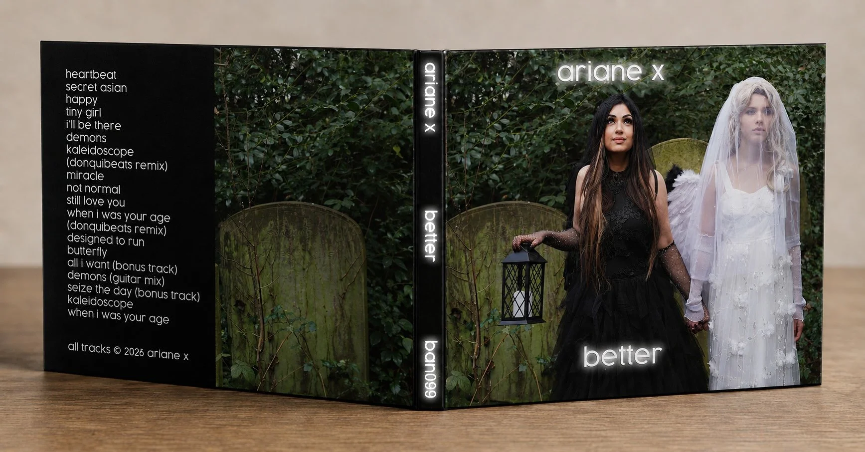 A CD of Ariane X dressed all in black in a graveyard with her daughter Lily dressed as an angel