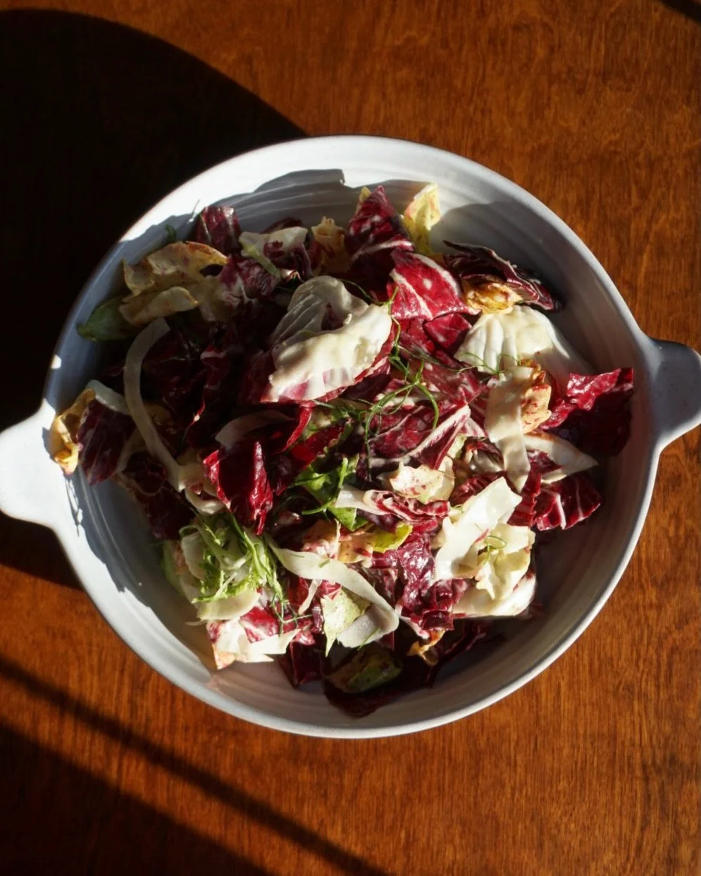 Bitter green salad with fennel, herbs and a mustard vinaigrette.