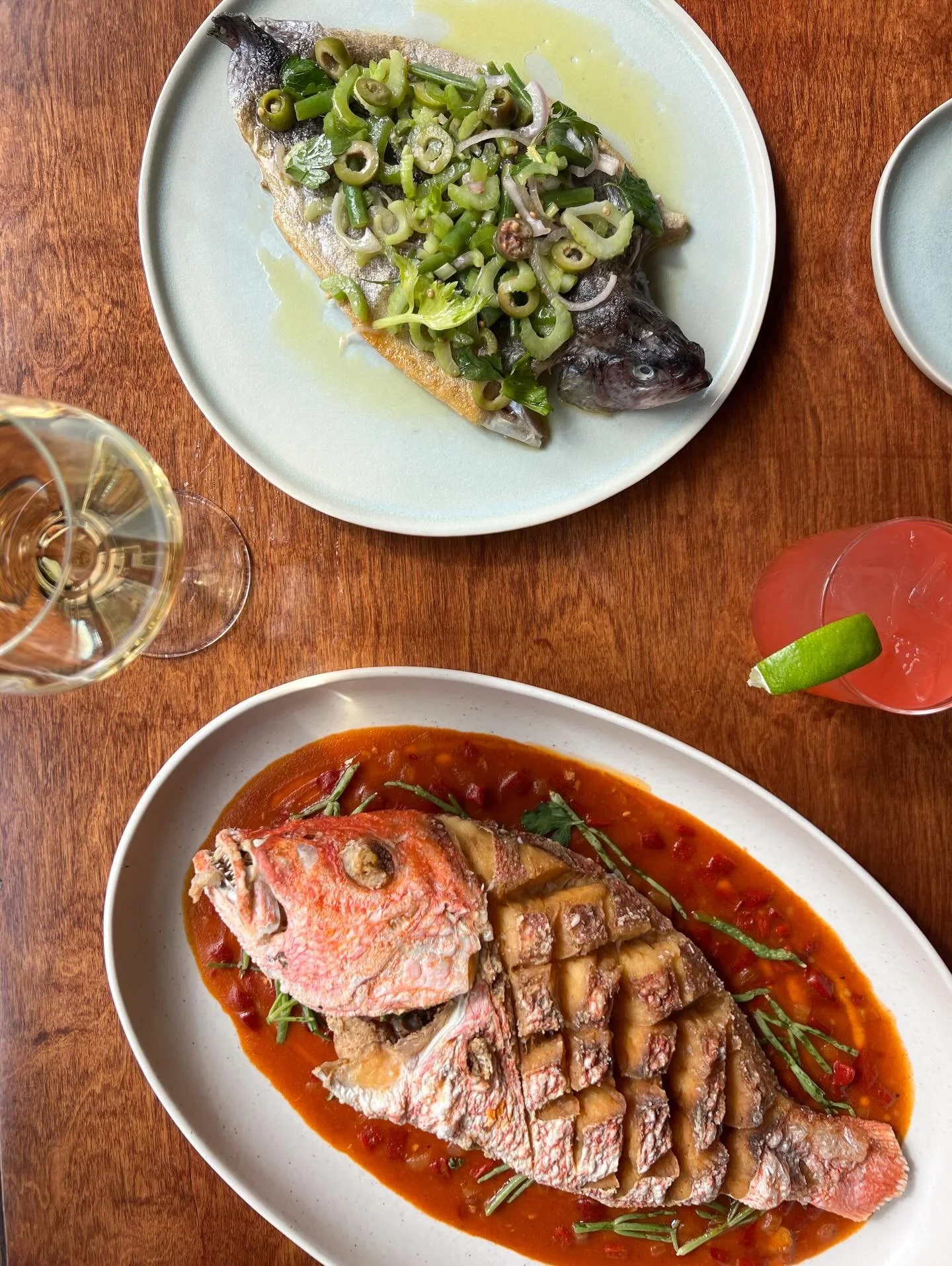 Carolina mountain trout with garden beans, green olive and celery, alongside our whole fried snapper with piperade, sea beans and sauce creole!
