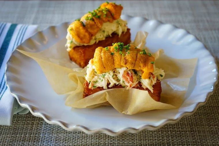 close up image of little water's hash browns topped in crab salad and maine uni