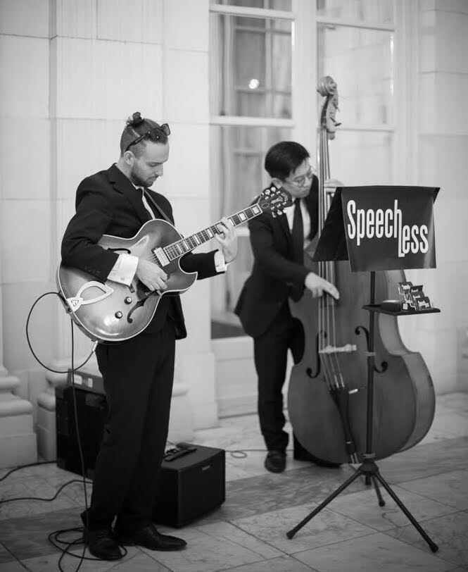 Jazz Duo with guitar and upright bass play classic jazz tunes at luxury event