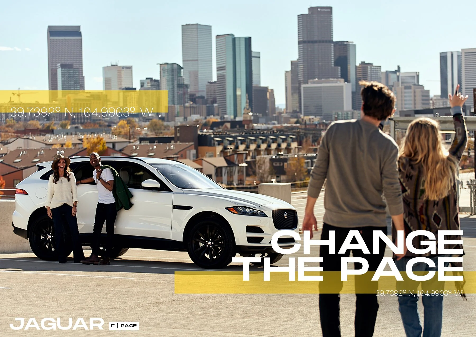 A group of four young people standing on a rooftop parking lot with a city skyline in the background. Two are standing near a white Jaguar F-PACE, smiling, while the other two walk away, one with an arm raised. The scene suggests a casual, social atm