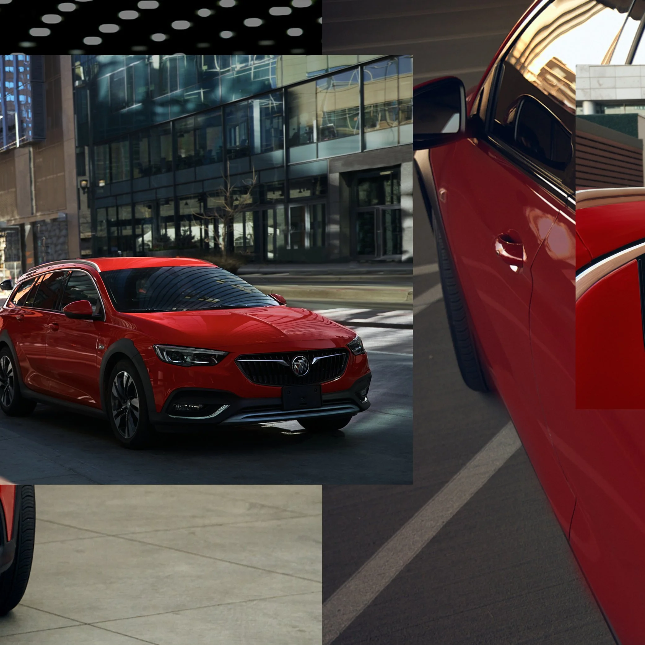 A red sedan parked on a city street in front of modern glass buildings.