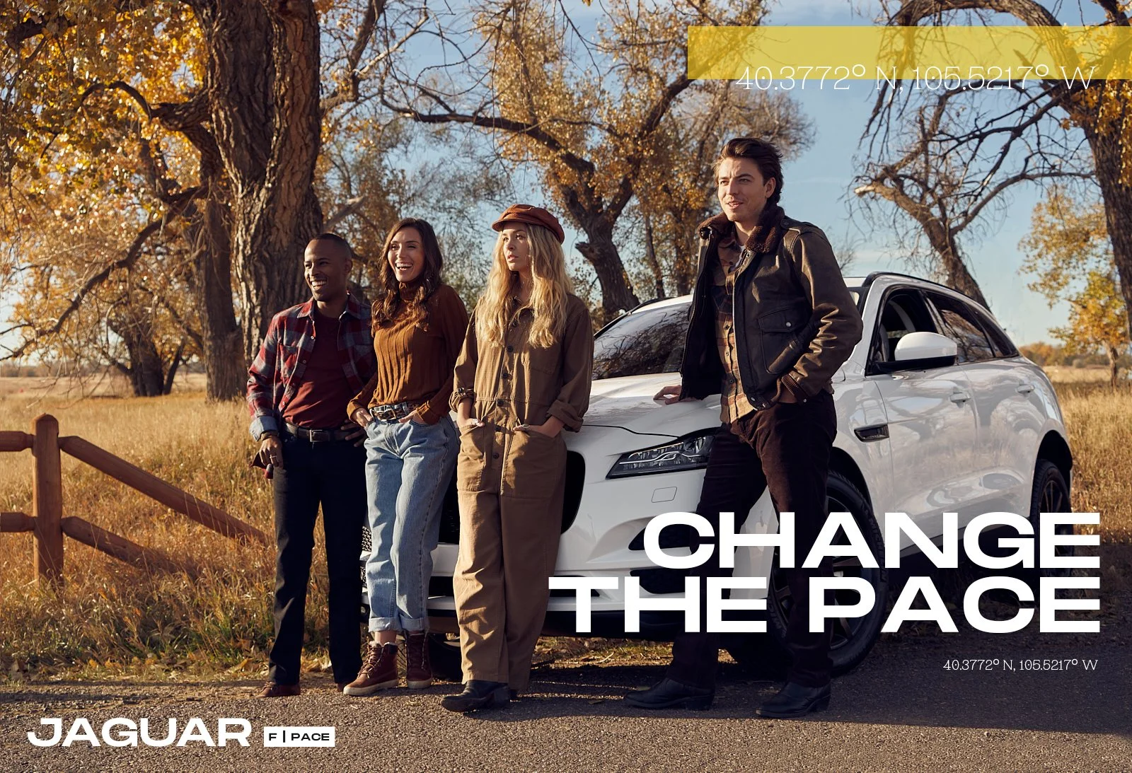 Four diverse people standing outdoors next to a white Jaguar vehicle on a fall day with trees and a blue sky in the background.