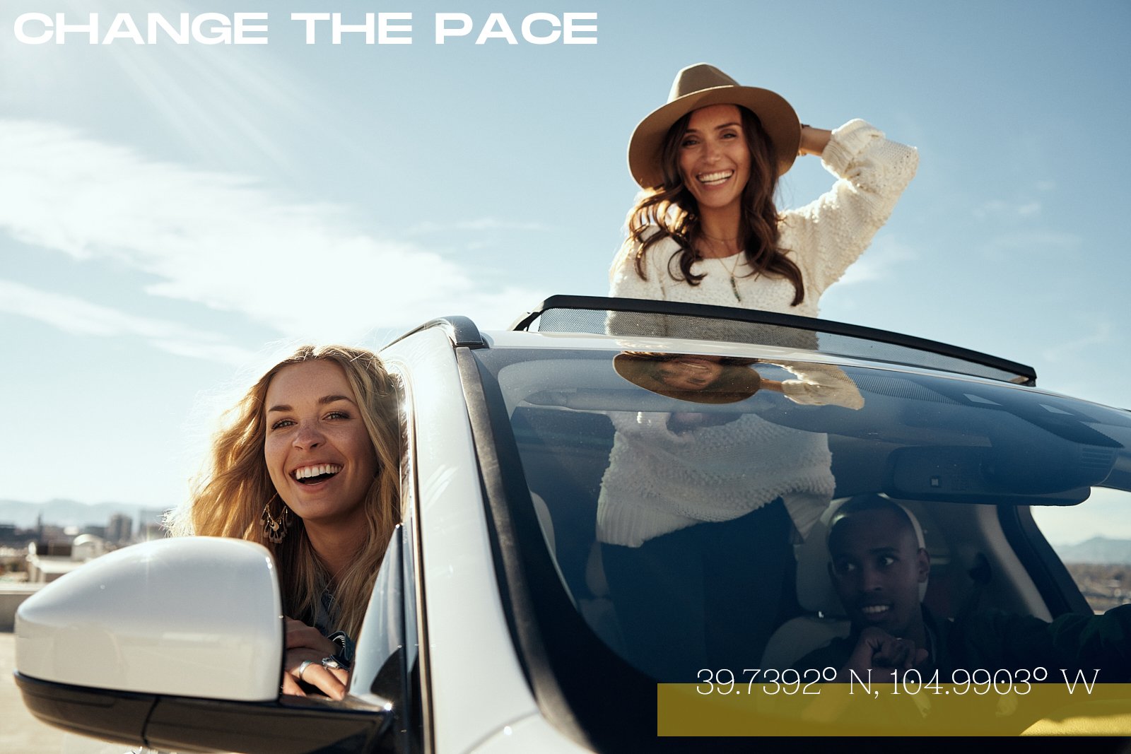 Two smiling women and a young boy in a car with one woman standing through the sunroof, wearing a hat, while the driver looks on. The sky is clear and sunny, with text saying 'CHANGE THE PACE' and coordinates 39.7392° N, 104.9903° W.