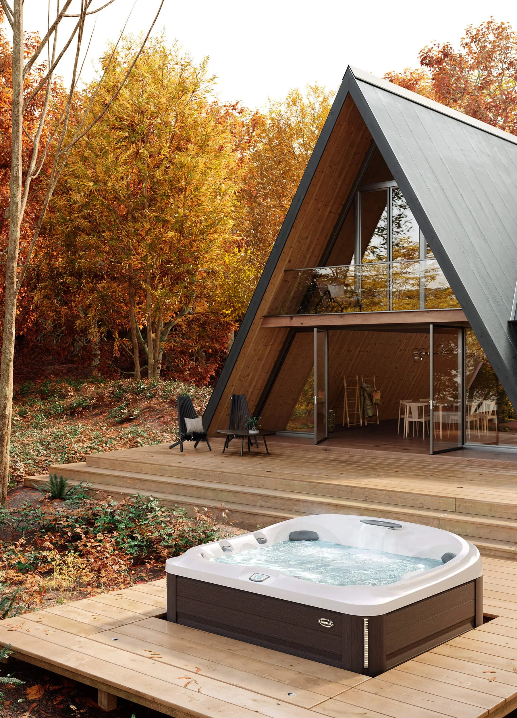 Hot tub inset into wooden deck in backyard of A-frame cabin in woods