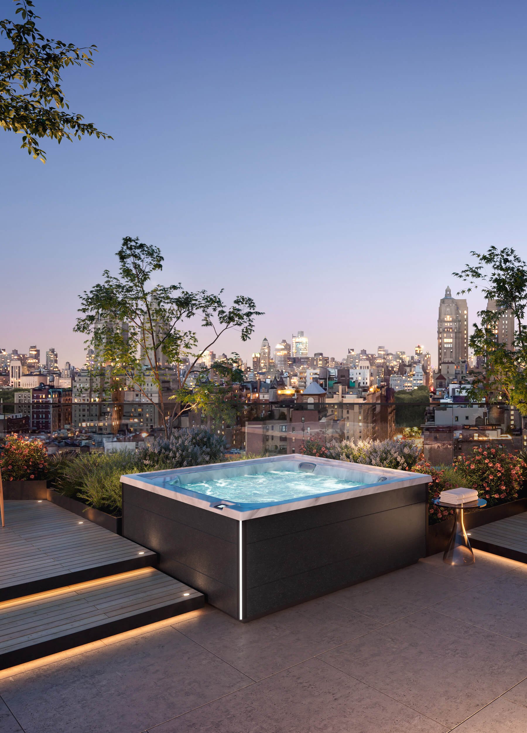 Product image - Jacuzzi® J408L™ Hot Tub on rooftop deck with cityscape view at sunset.
