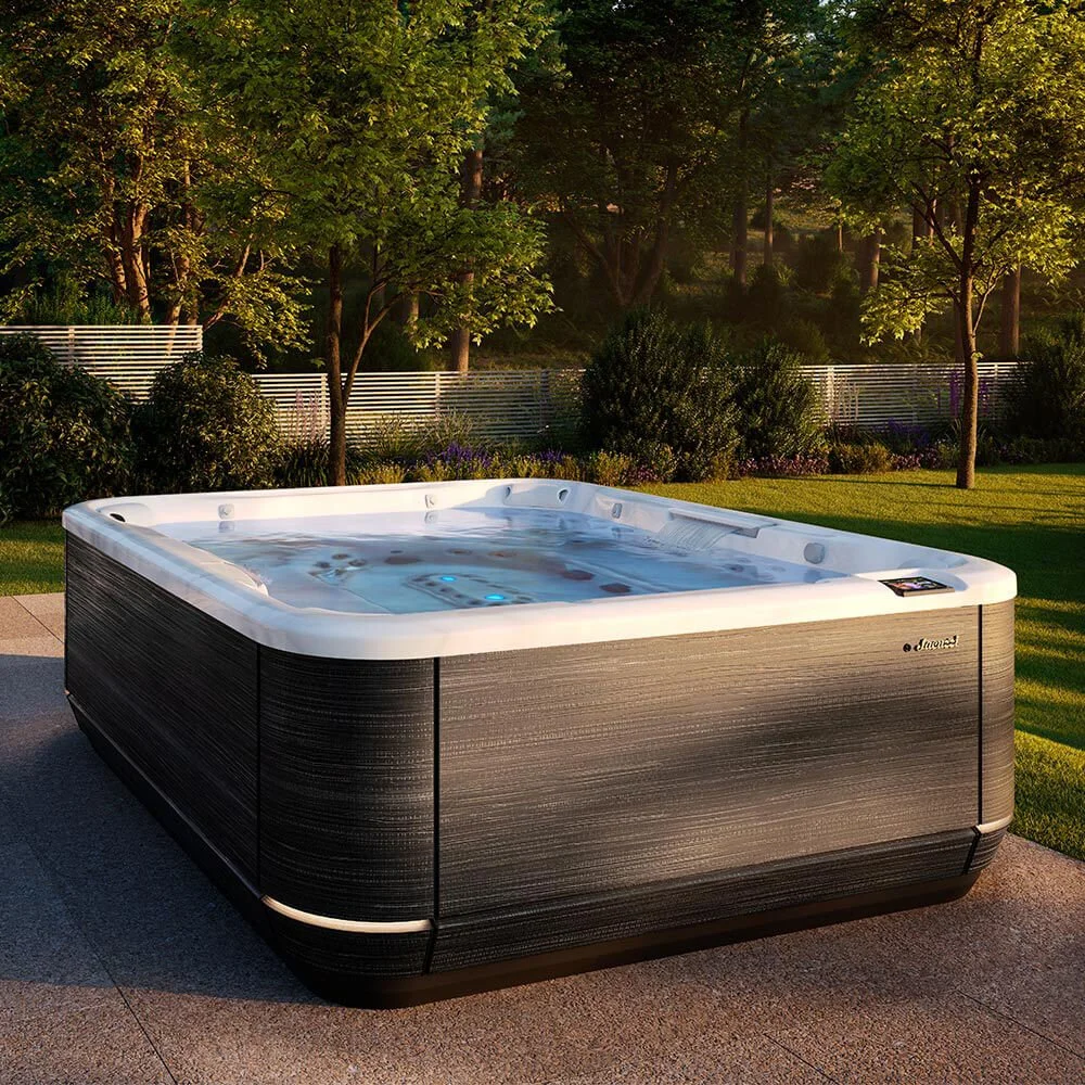 J509L™ Hot Tub in a residential grassy backyard setting