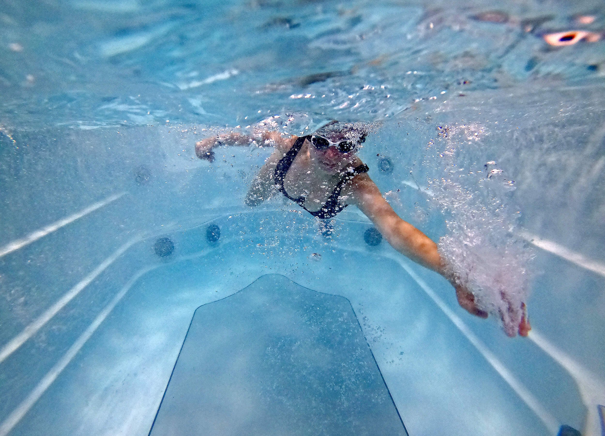 Underwater photo of swimmer in a swim spa
