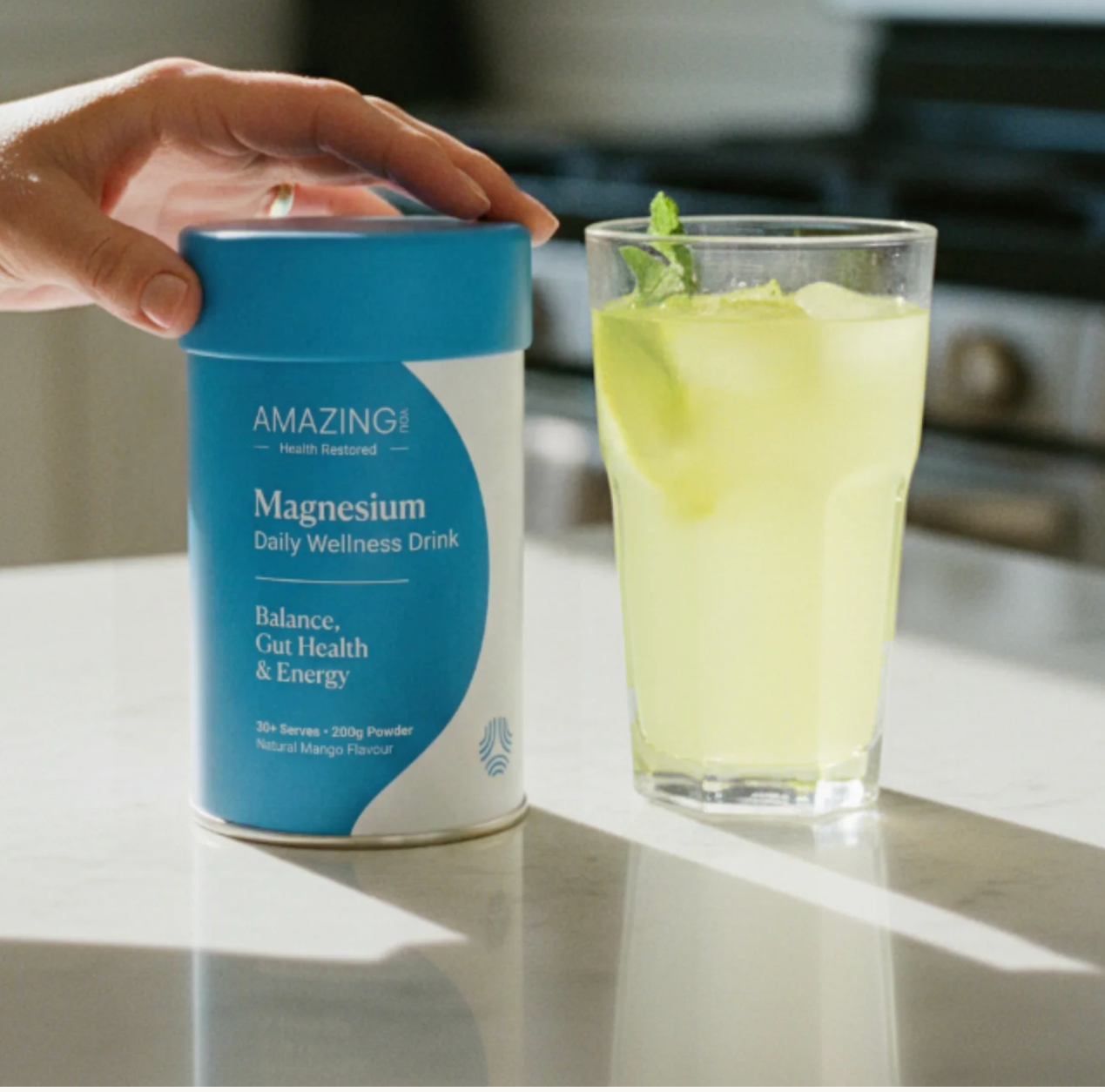 AY DAILY Wellness Drink with glass.png
