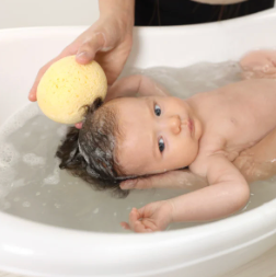 TN Baby in bath pic.png