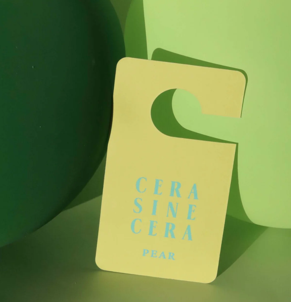 Floral fragrance tag for closet and bag, styled with polished nails and hand care essentials. Aesthetic accessory for nail salon clients and beauty lovers like Mellow Bar.