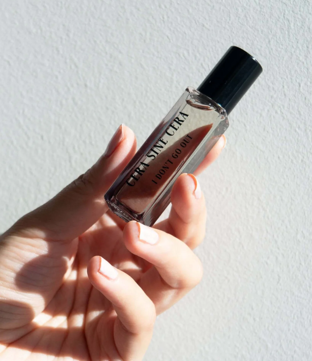 Luxury roll-on perfume oil for clean beauty routine, shown with manicured nails. Non-toxic fragrance for Japanese Gel Manicure nail salon clients, hand care, and everyday beauty like Mellow Bar.