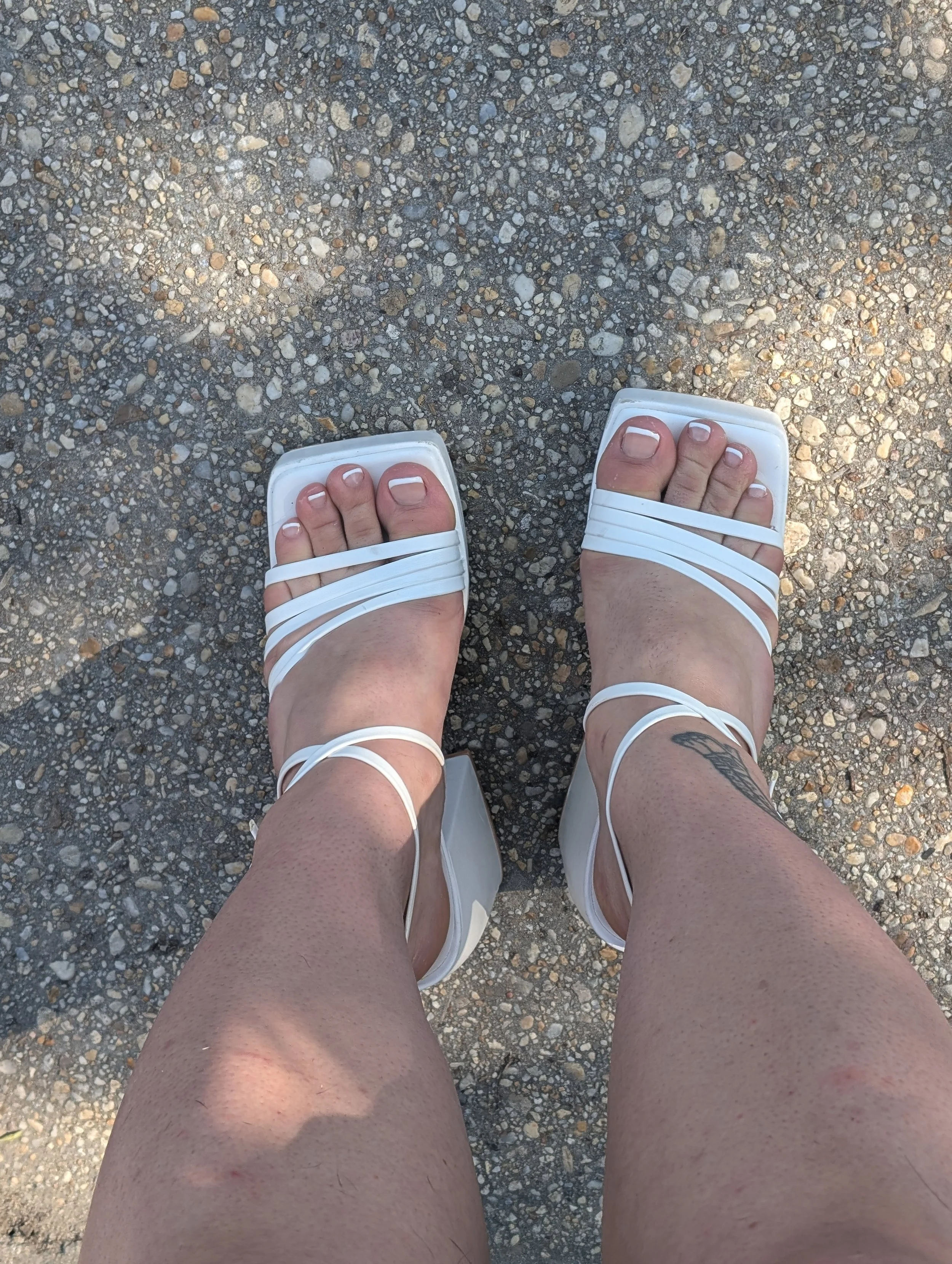 feet in white heels standing w french.jpeg