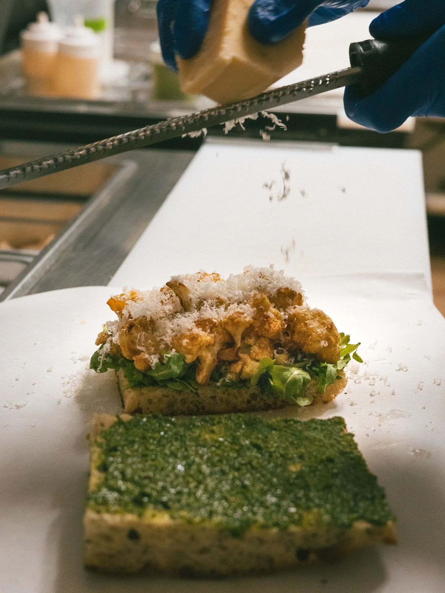 miso roasted cauliflower, green chile ajika, arugula, apple relish and a shower of parm on top

cashew parm for y&rsquo;all vegans too

while they try to burn the world down
keep calm &amp; cauli on