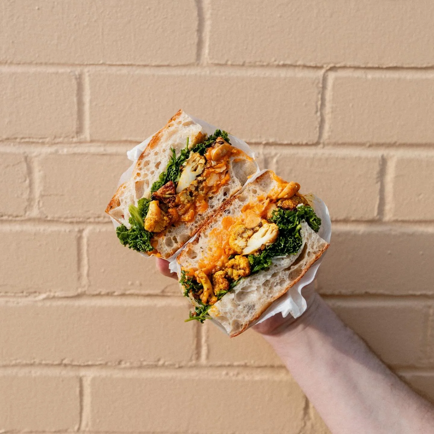 a new veg sandwich for spring

cauliflower shawarma, spicy sweet potato spread, marinated chickpeas, kale herb salad, mujadara crunch

we are going back to cauli