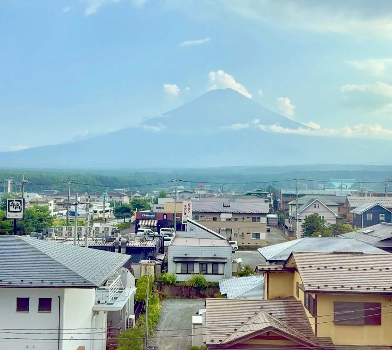 View of Mount Fuji over a quiet Japanese town — reflecting on Third Culture Kid identity, belonging, and growing up between cultures | Neurodiversity Wellness Collective