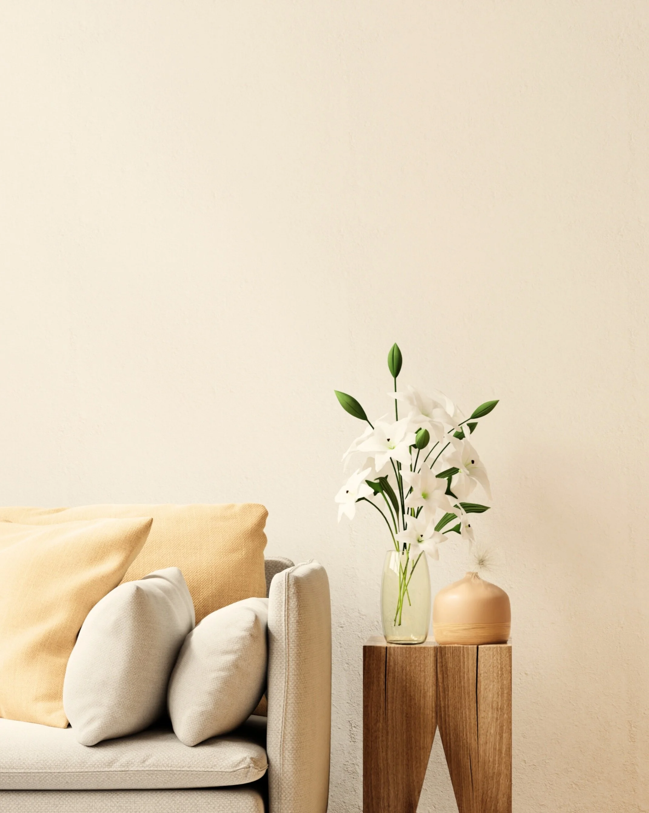 Cozy cream armchair next to a potted fern on a light background, symbolizing accessible, low-cost counselling and welcoming therapy spaces.