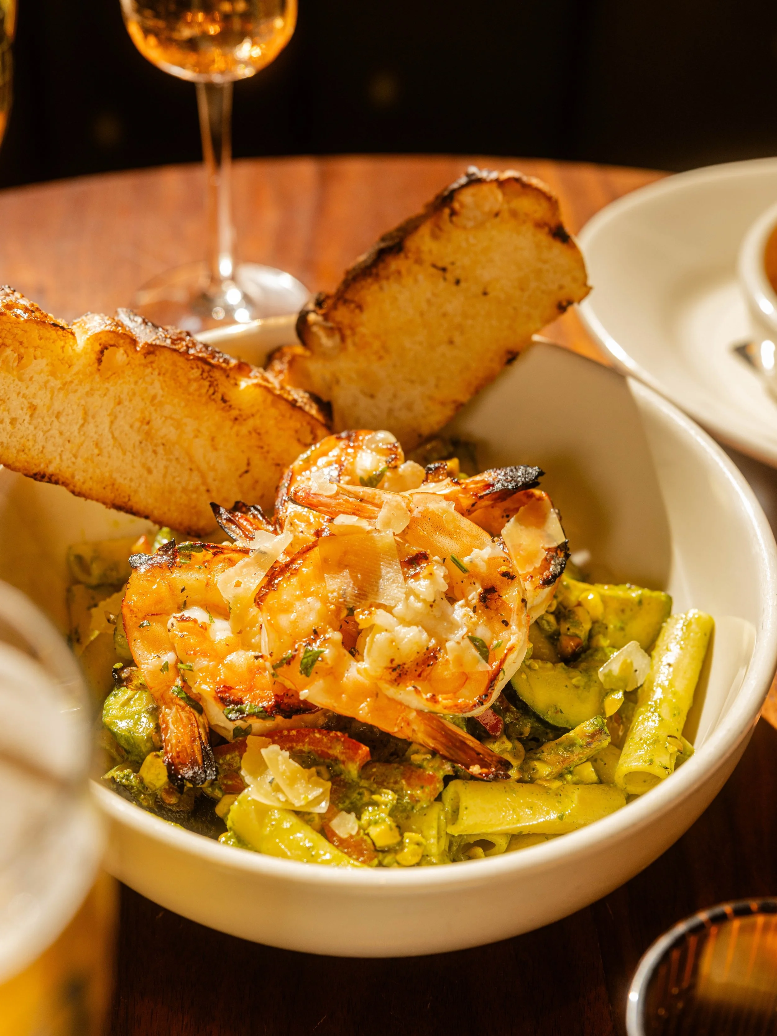 Your sign to order the pasta.

The Ziti-Ziti Top Pasta brings together lemon butter grilled shrimp, arugula-pecan pesto, red bell peppers, zucchini, corn and garlic-toasted focaccia.

One bite and suddenly you&rsquo;re very glad you went with the pas