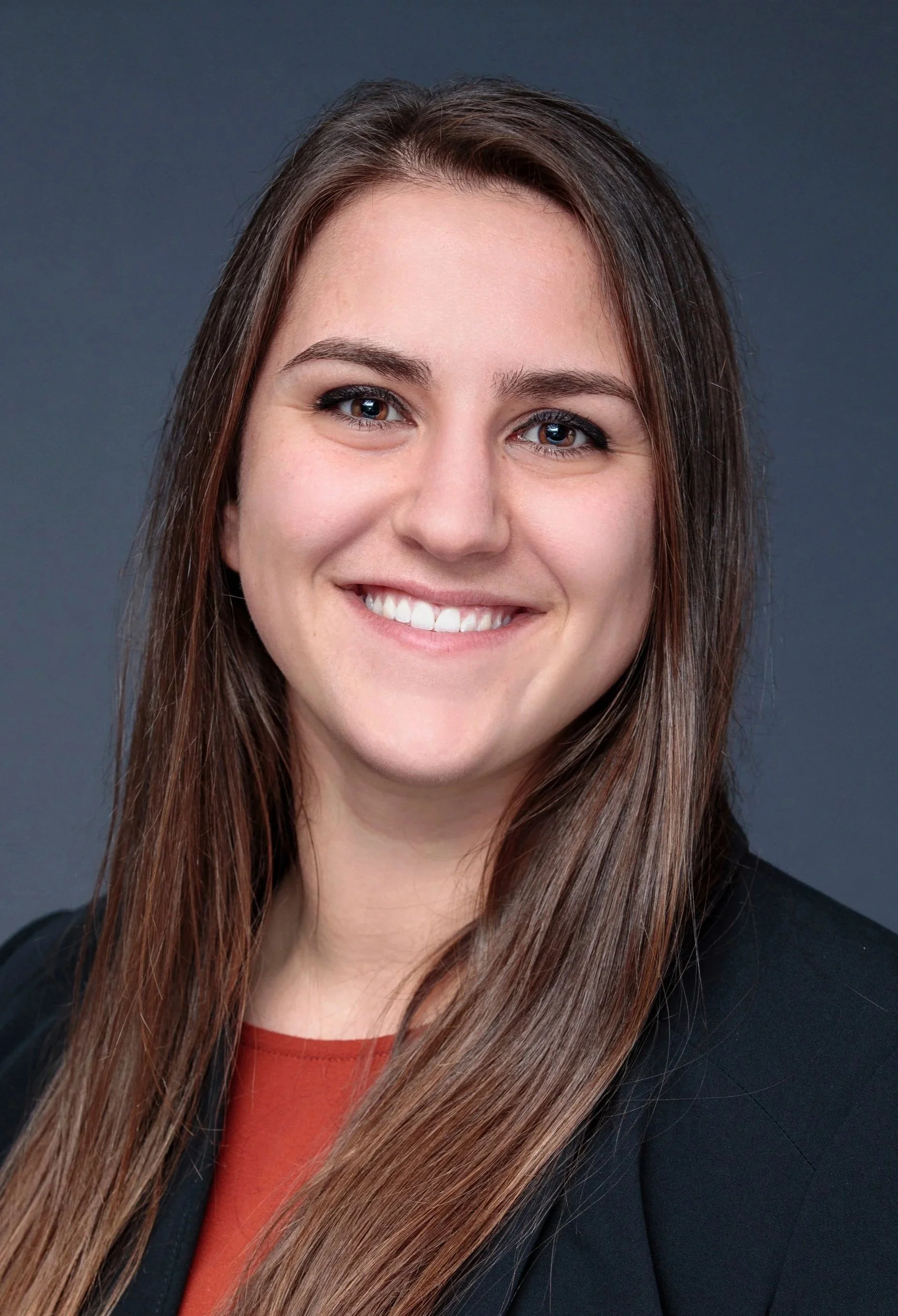 Headshot of Taylor Gabler. She is smiling with brown eyes and brown hari.