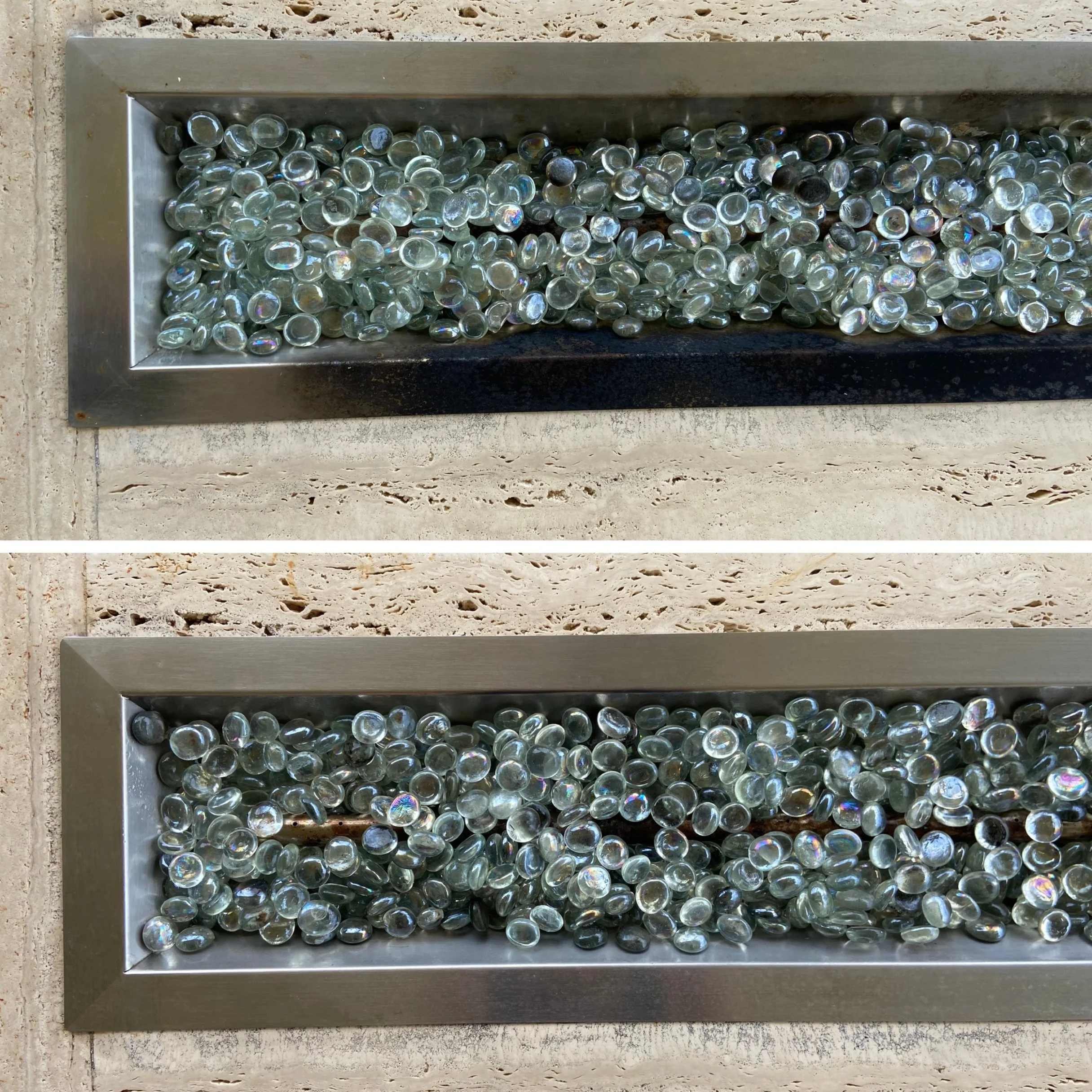 Two metal trays filled with small, clear, round glass marbles, placed on a textured beige surface.