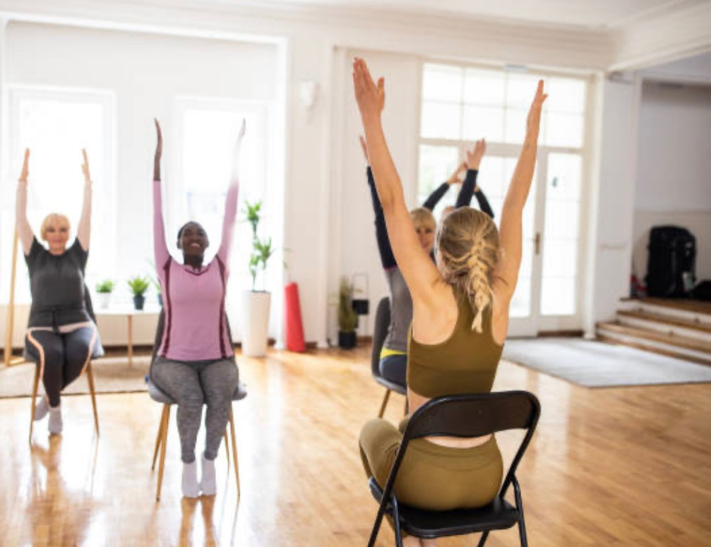 People doing chair yoga