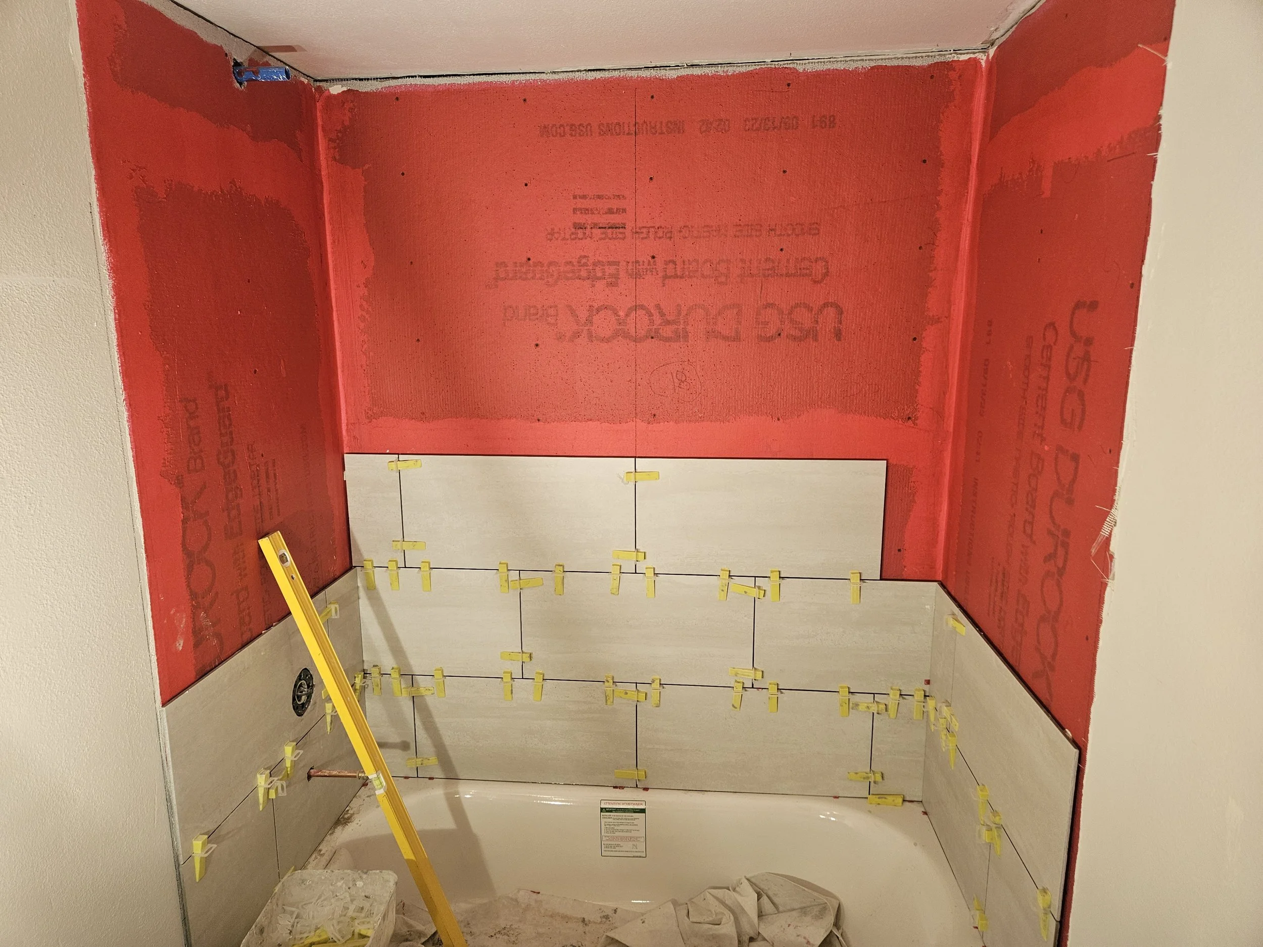 Bath tiling in progress.jpg
