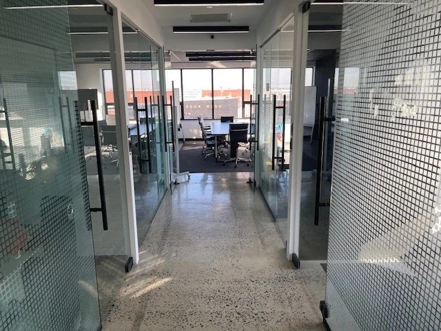 brooklyn-beyond-glass-hallway.webp